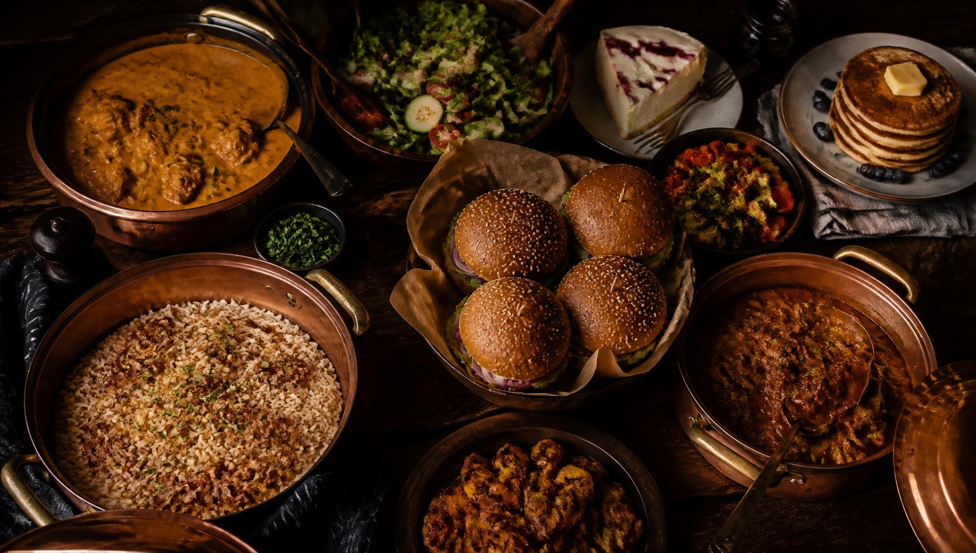 Table spread of homemade food cooked by Copper Pot Kitchen